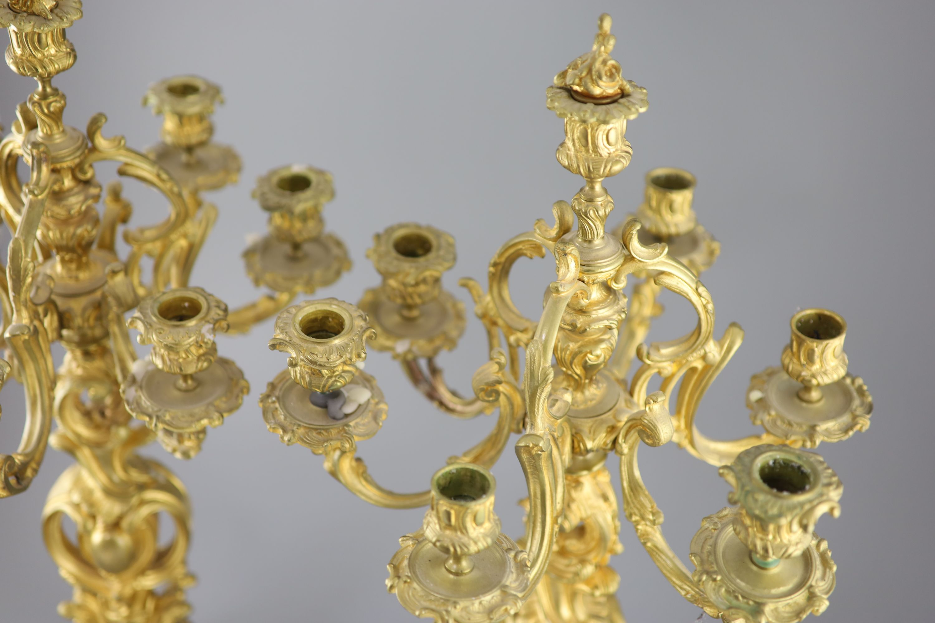 A pair of late 19th century French Louis XV style ormolu seven light candelabra, height 26in.